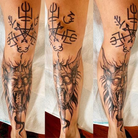Rhea Satanic Leg Tattoos.